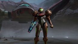 Space bounty Hunter Samus Aran stands in front of her ship in full armor, brandishing her hand cannon, in Metroid Prime 4 Beyond